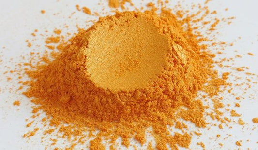 A mound of orange Coenzyme q10 powder